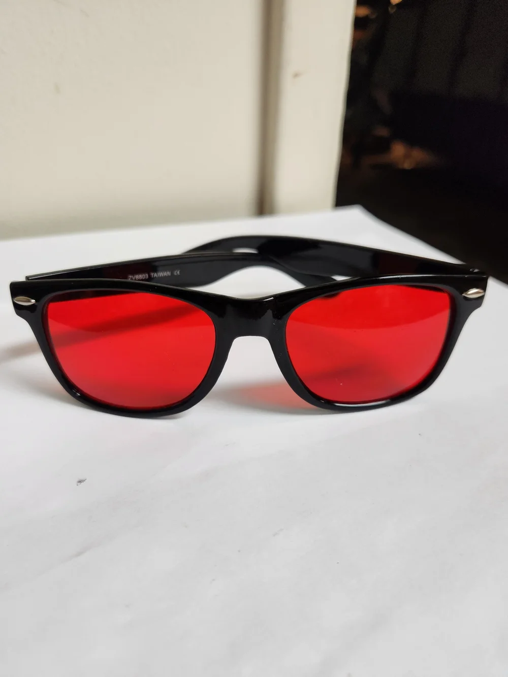 Source Unknown Black Sunglasses with Red Lenses